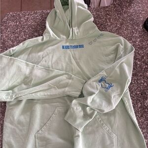 Light Green Hoodie with Blue Graphics